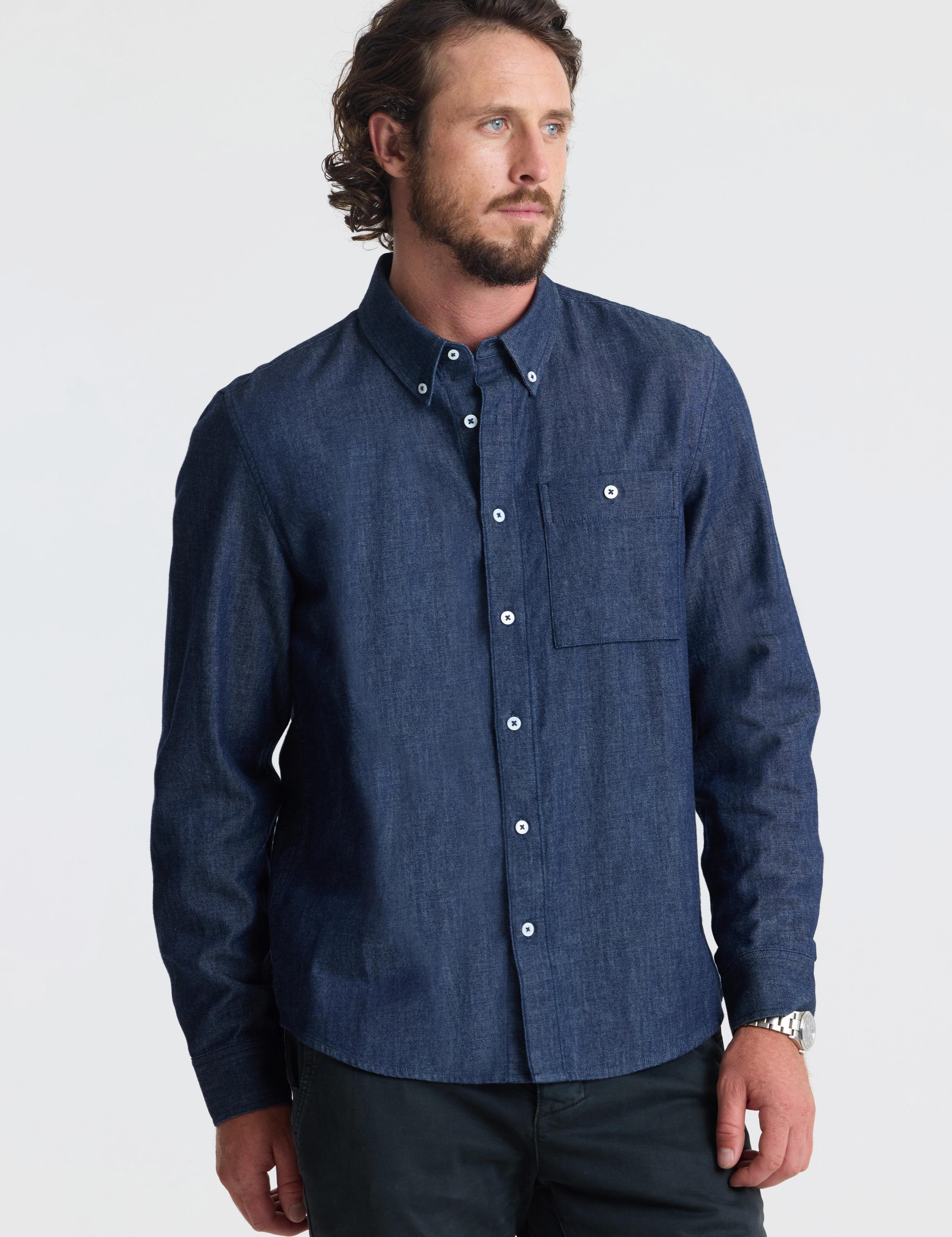 Man wearing Alder Chambray Button-Down in Dark Blue