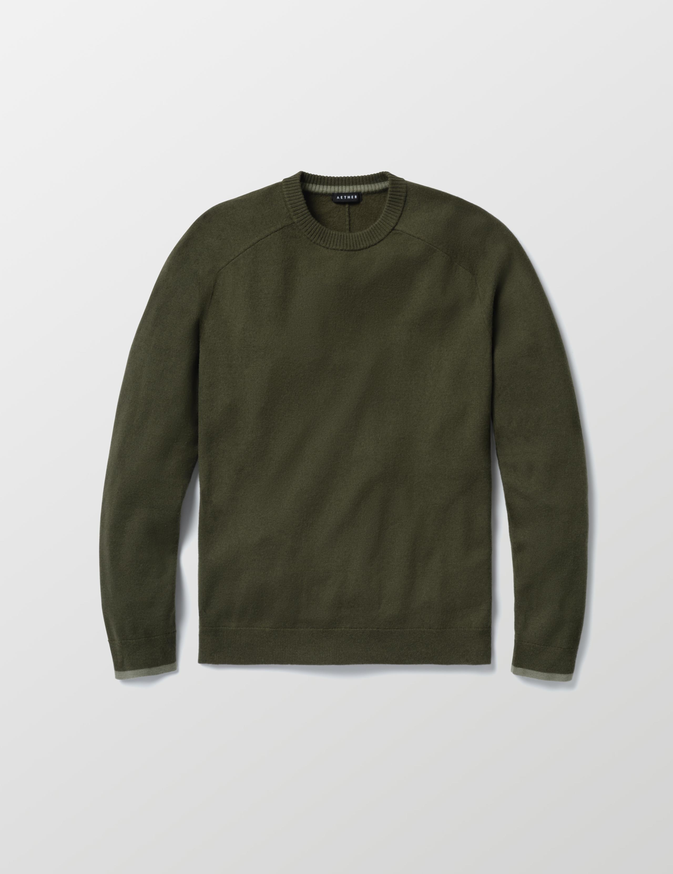 Studio laydown of Corbin Sweater in Forest Green