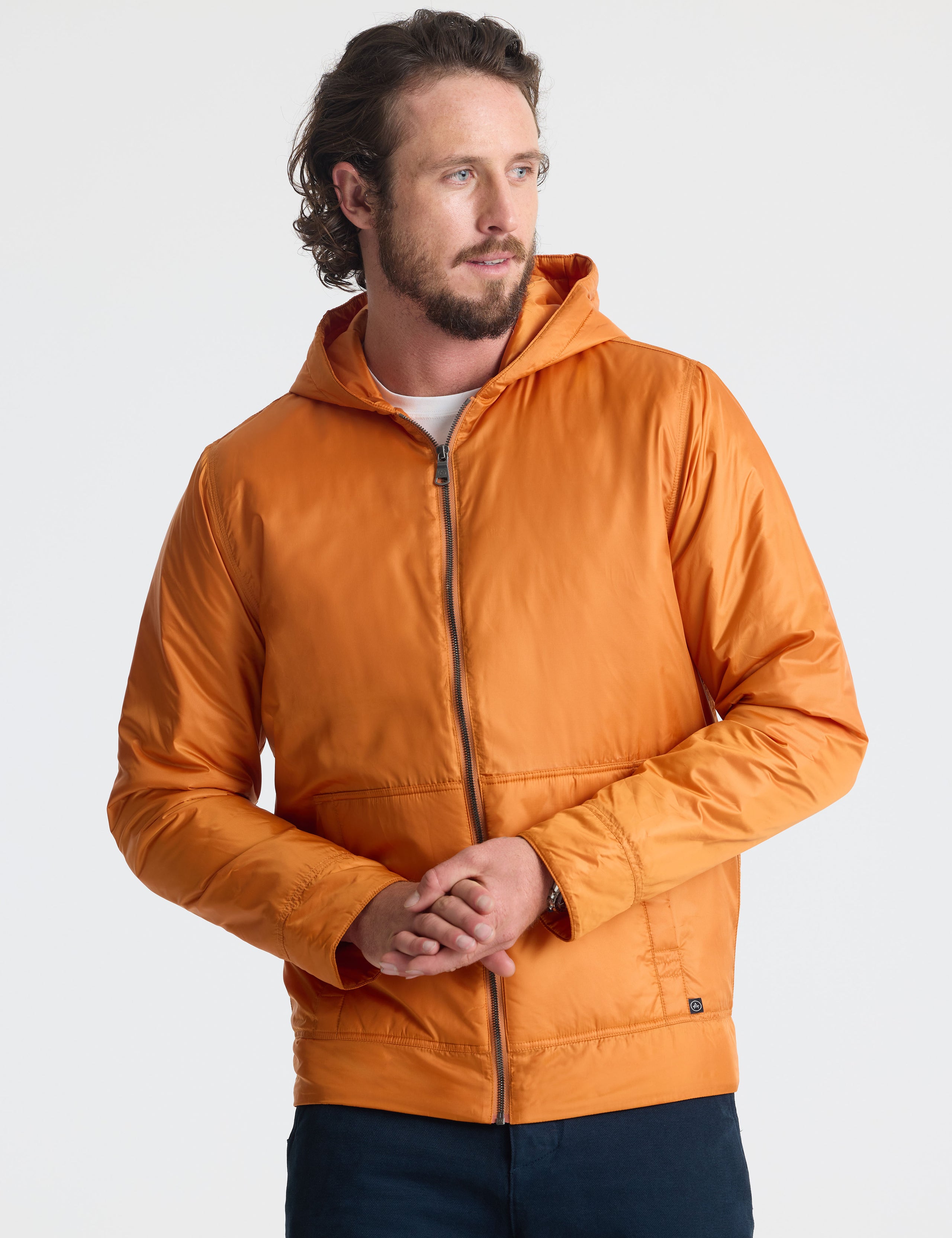 Front view of man wearing zipped Eco Space Hoodie in Autumn Orange from AETHER Apparel.