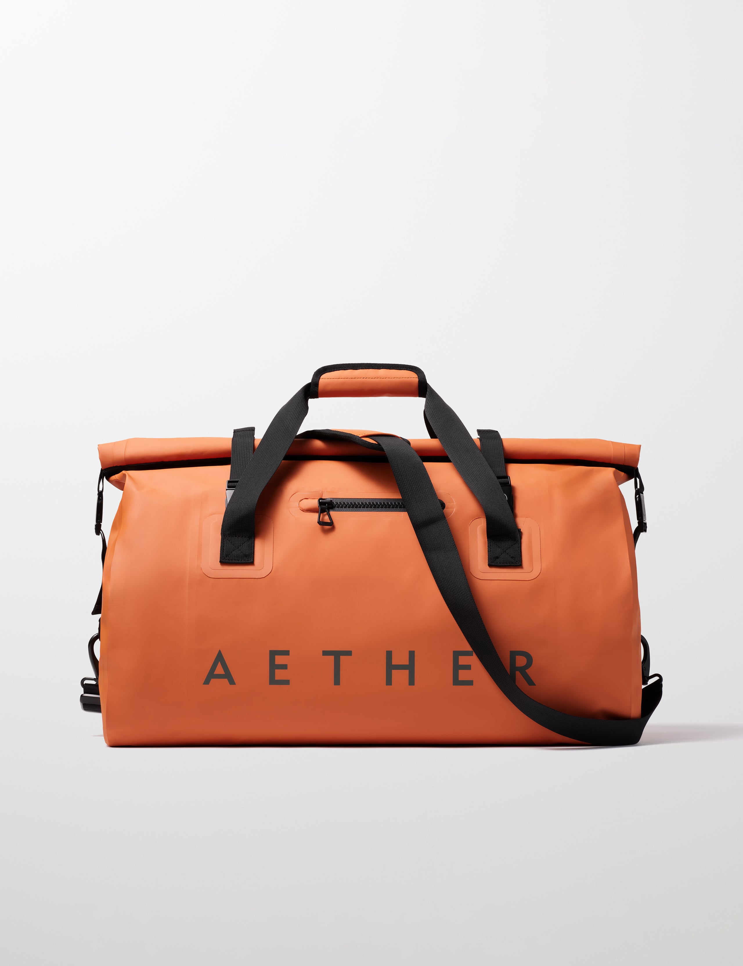 Front view of Excursion Duffle Bag 60L in Autumn Orange from AETHER Apparel.