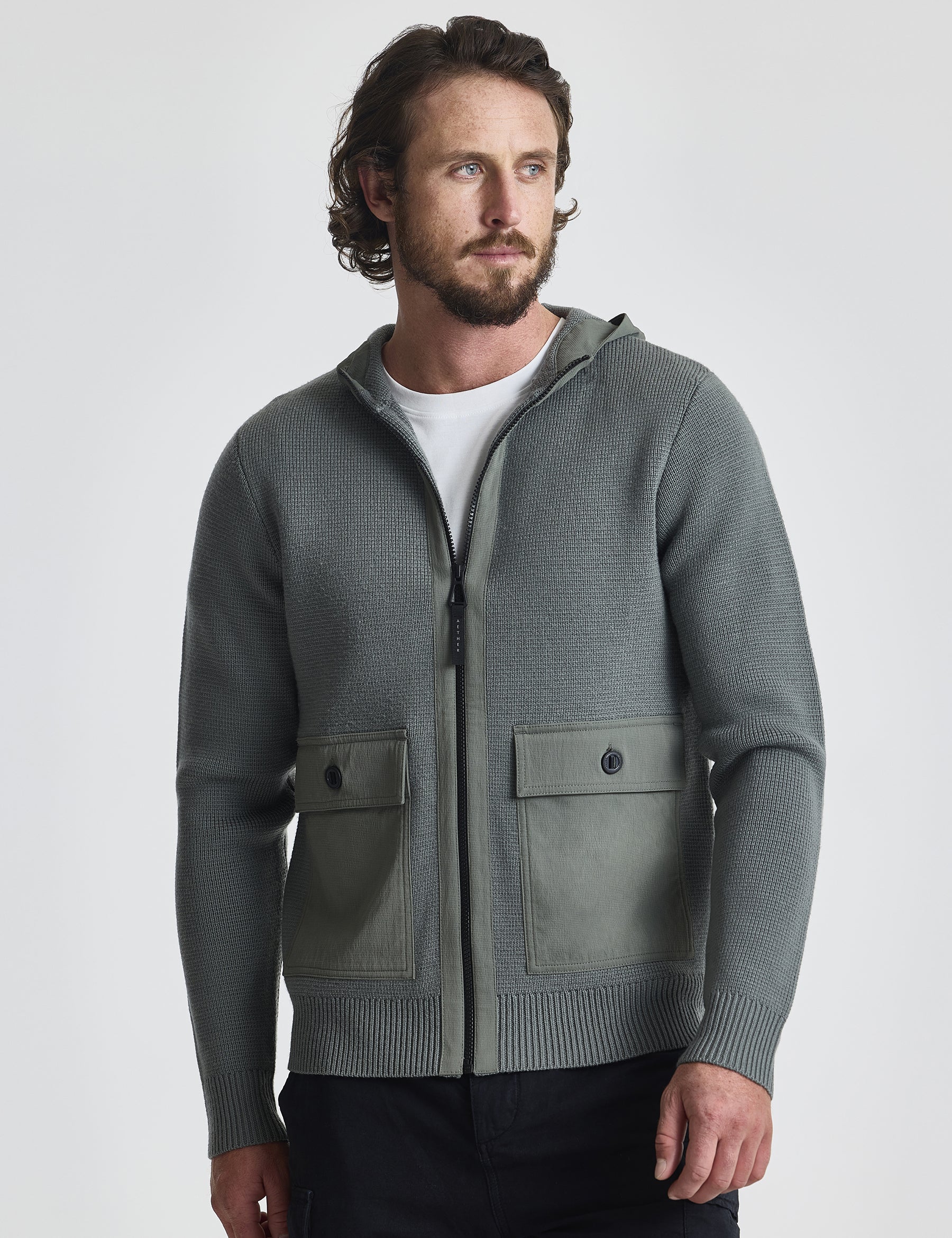 Front view of man wearing Benson Full-Zip Sweater in Gunmetal grey from AETHER Apparel.