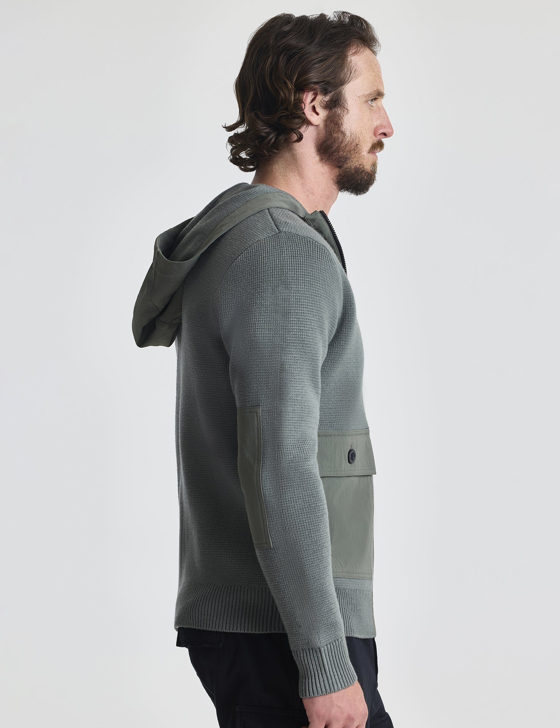 Right profile of man wearing Benson Full-Zip Sweater in Gunmetal grey from AETHER Apparel.