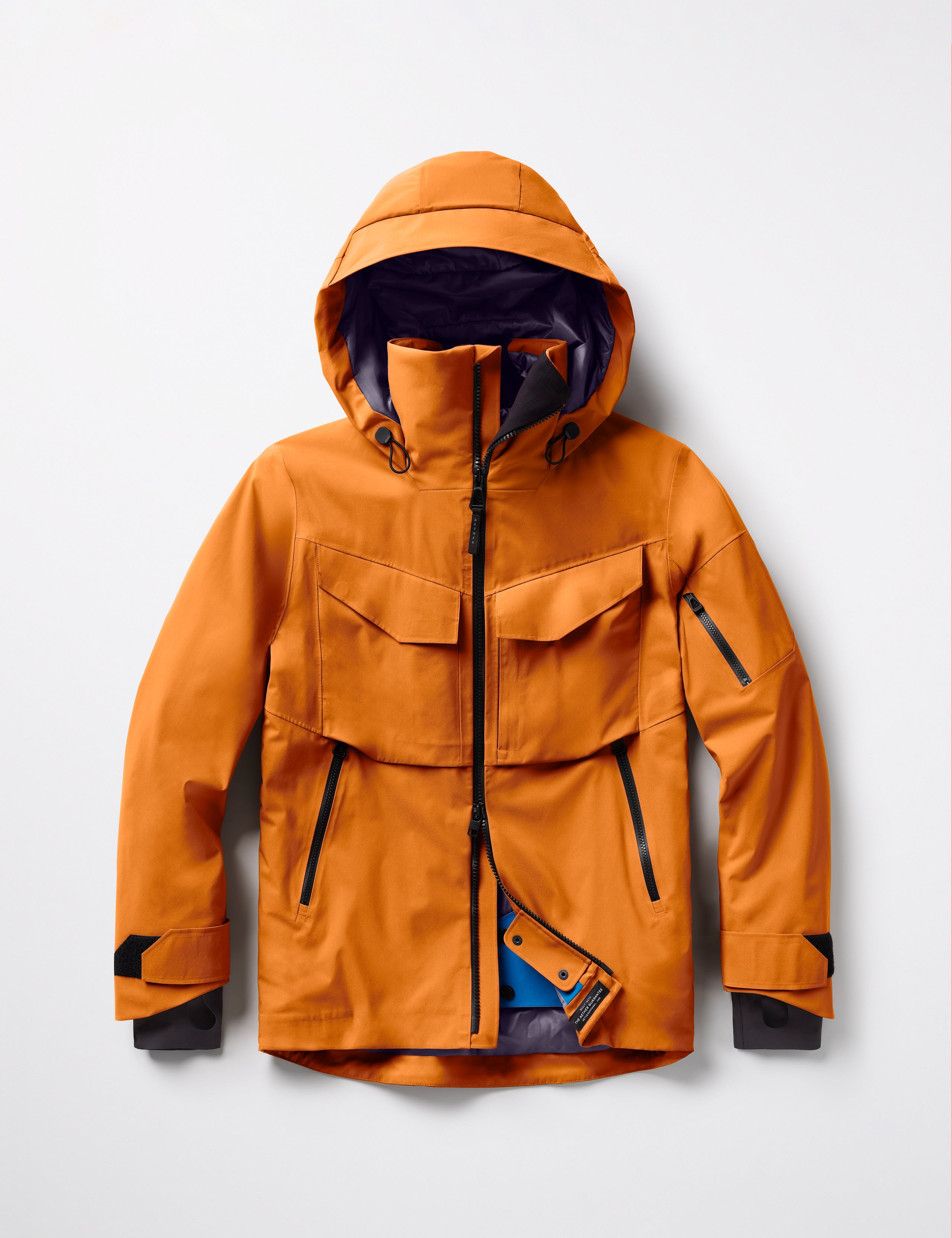 Flat lay of Brighton Insulated Snow Jacket in Autumn Orange from AETHER Apparel.