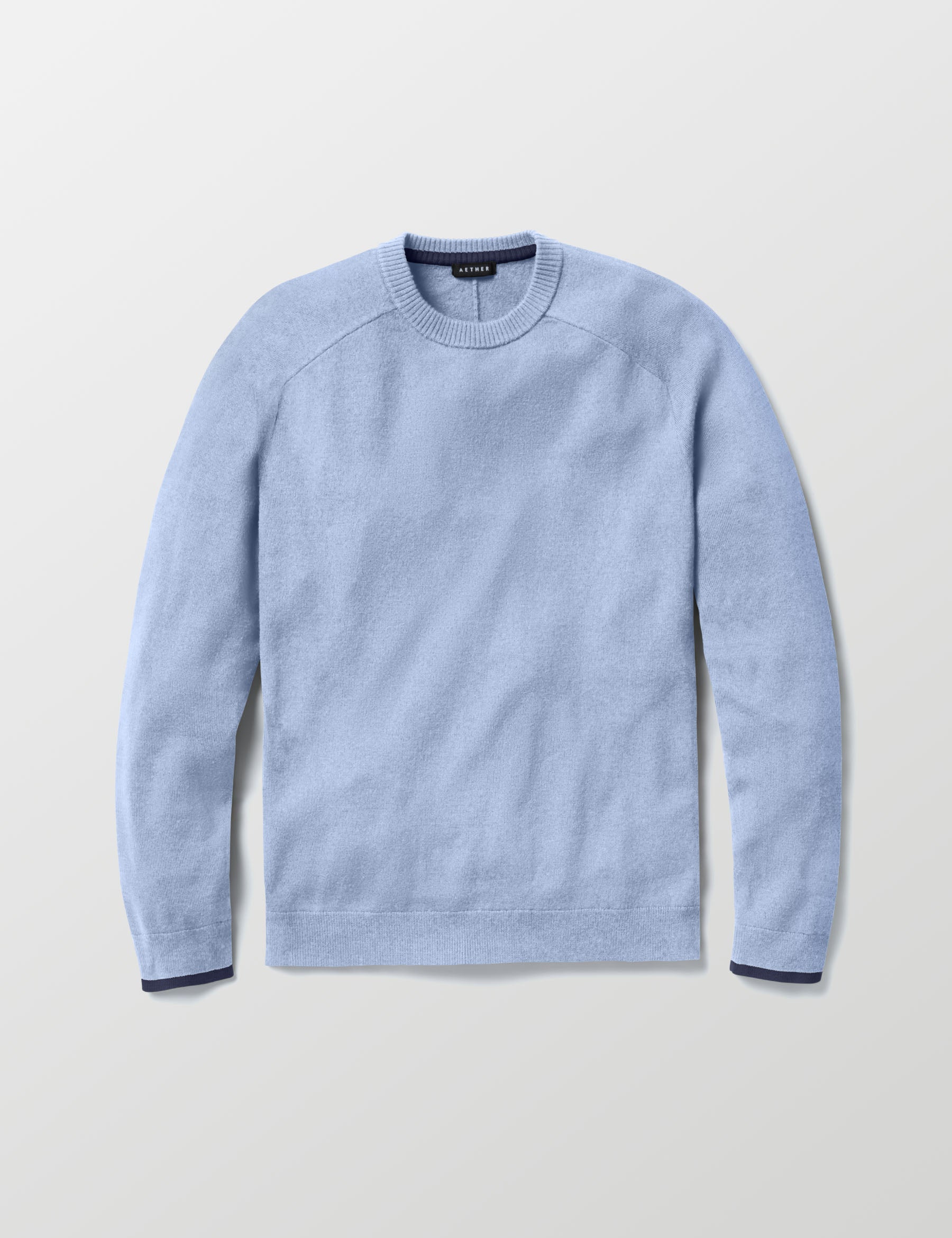 Flat lay image of Corbin Sweater in Light Blue Heather from AETHER Apparel. 