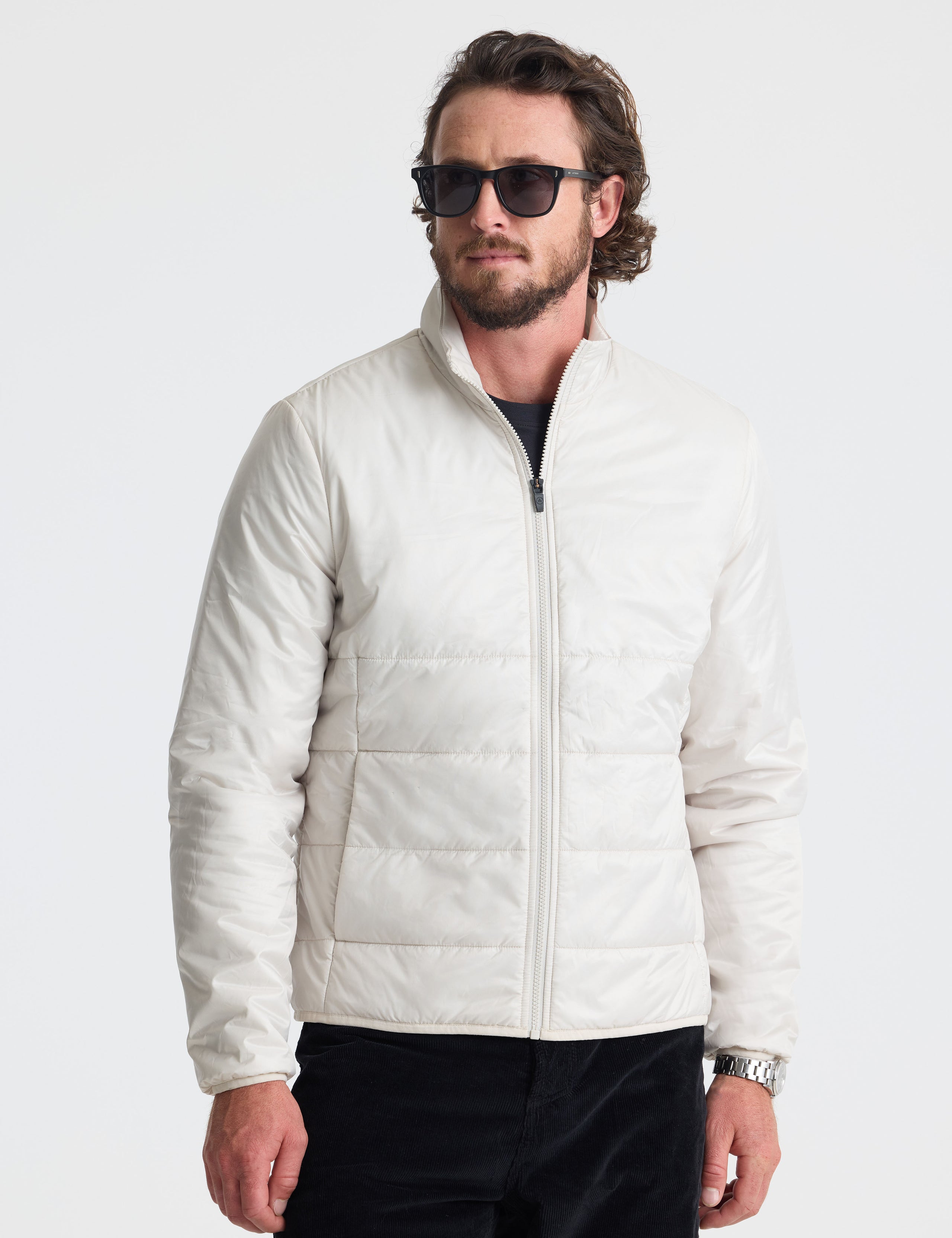 Front view of man wearing Eco Insulated Jacket in Bone white from AETHER Apparel.