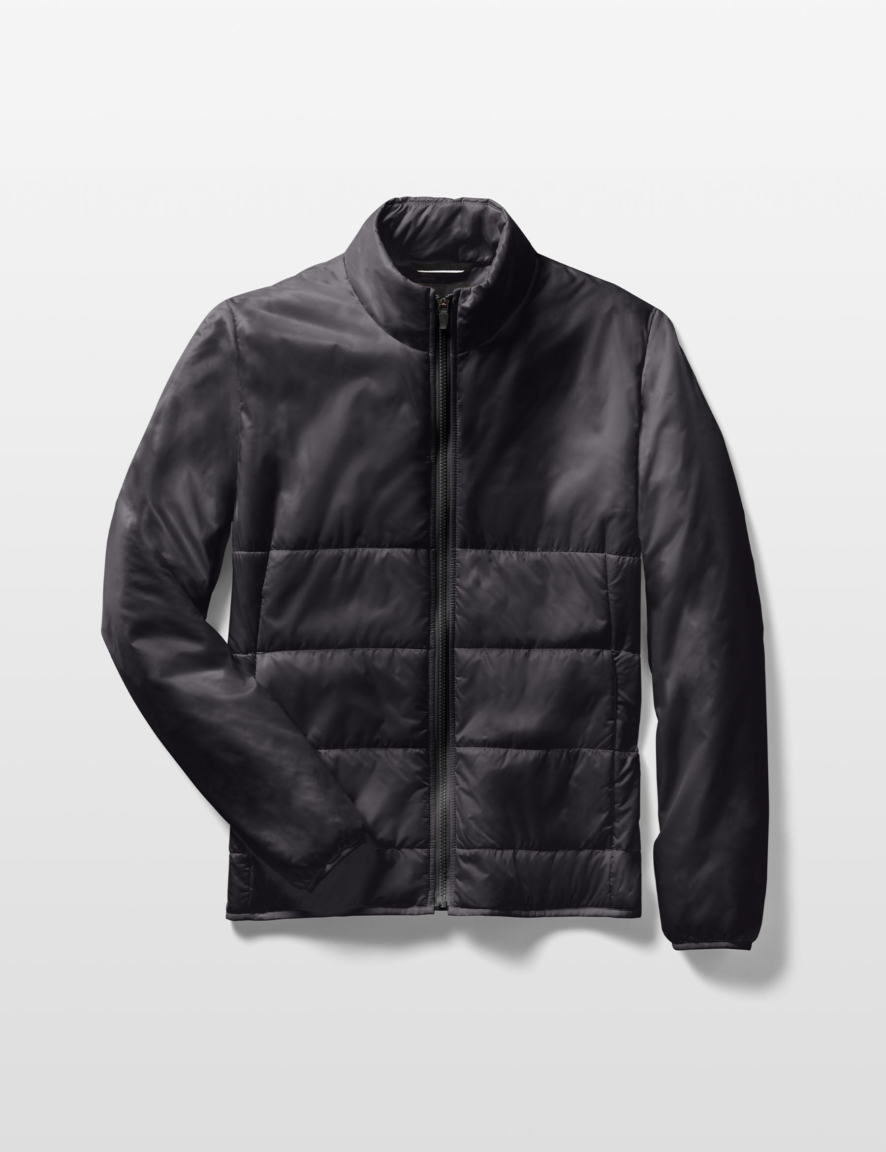 Flat lay of Eco Insulated Jacket in Onyx Black from AETHER Apparel.