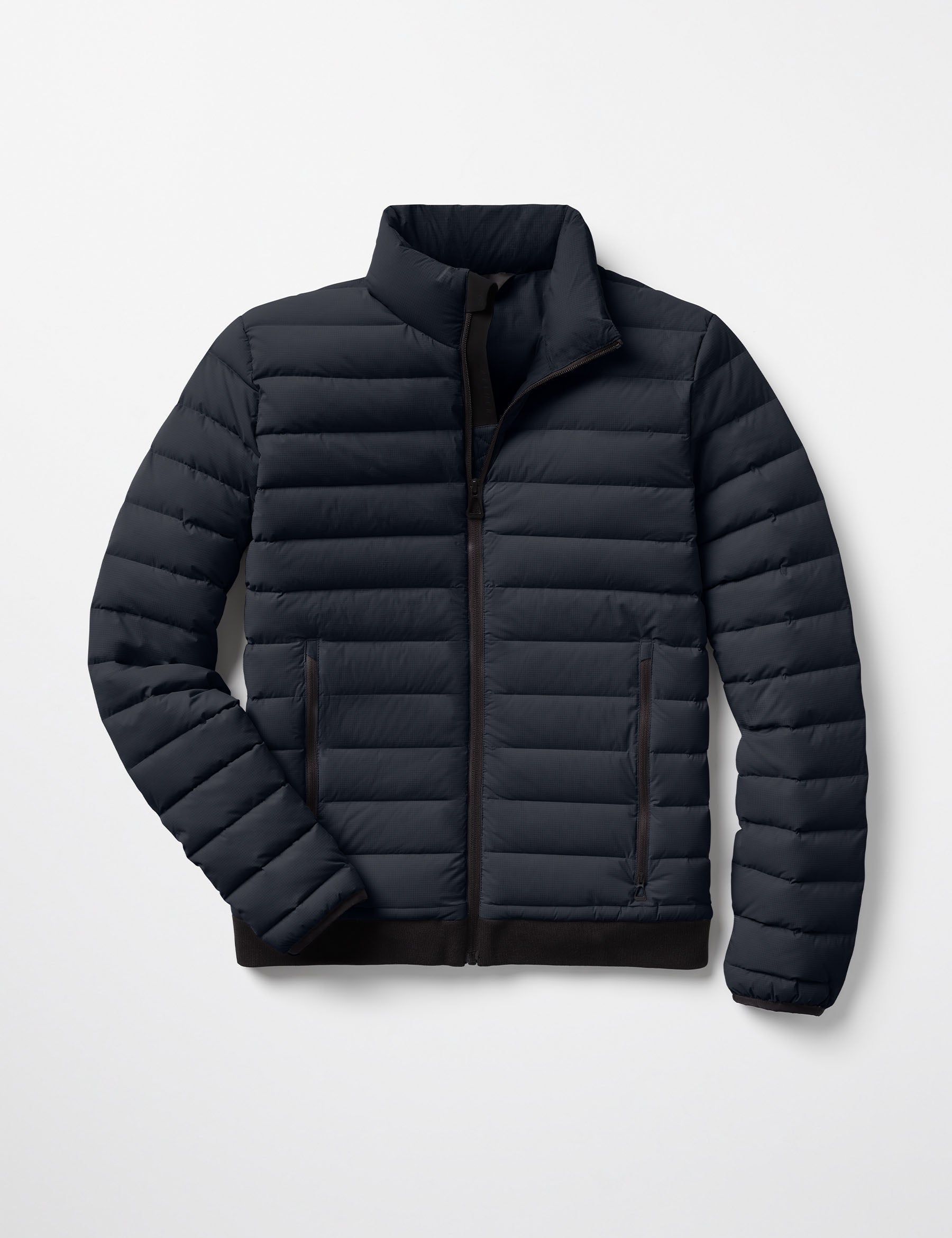 Flat lay of Launch Jacket in Onyx Black from AETHER Apparel.