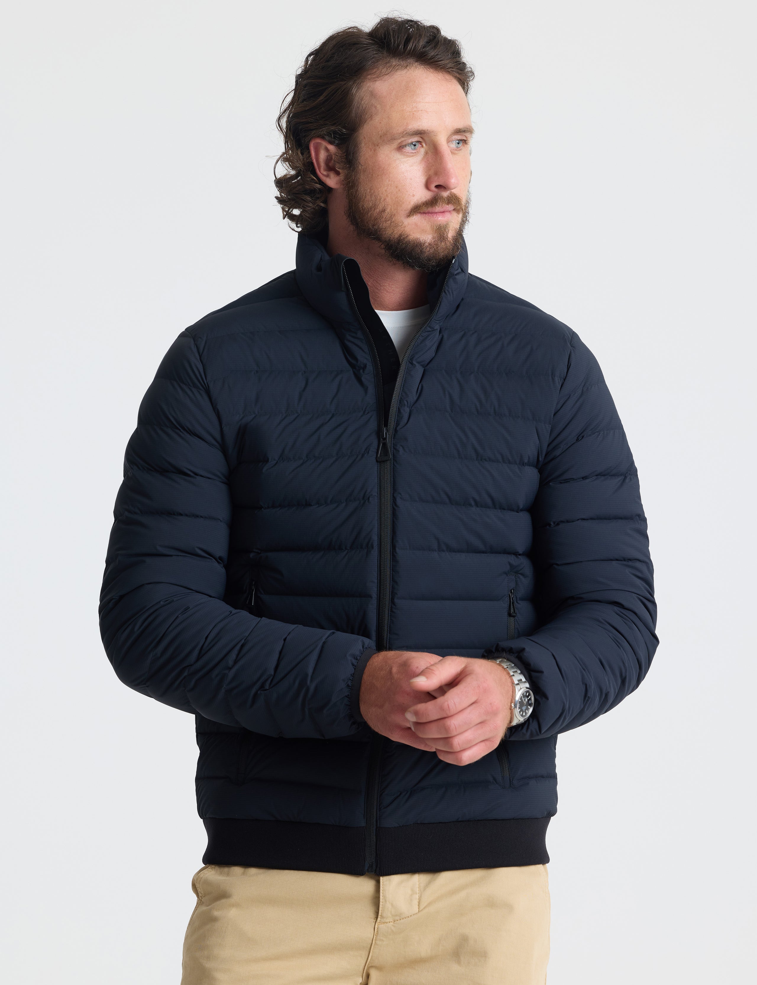 Front view of man wearing Launch Jacket in Onyx Black from AETHER Apparel.