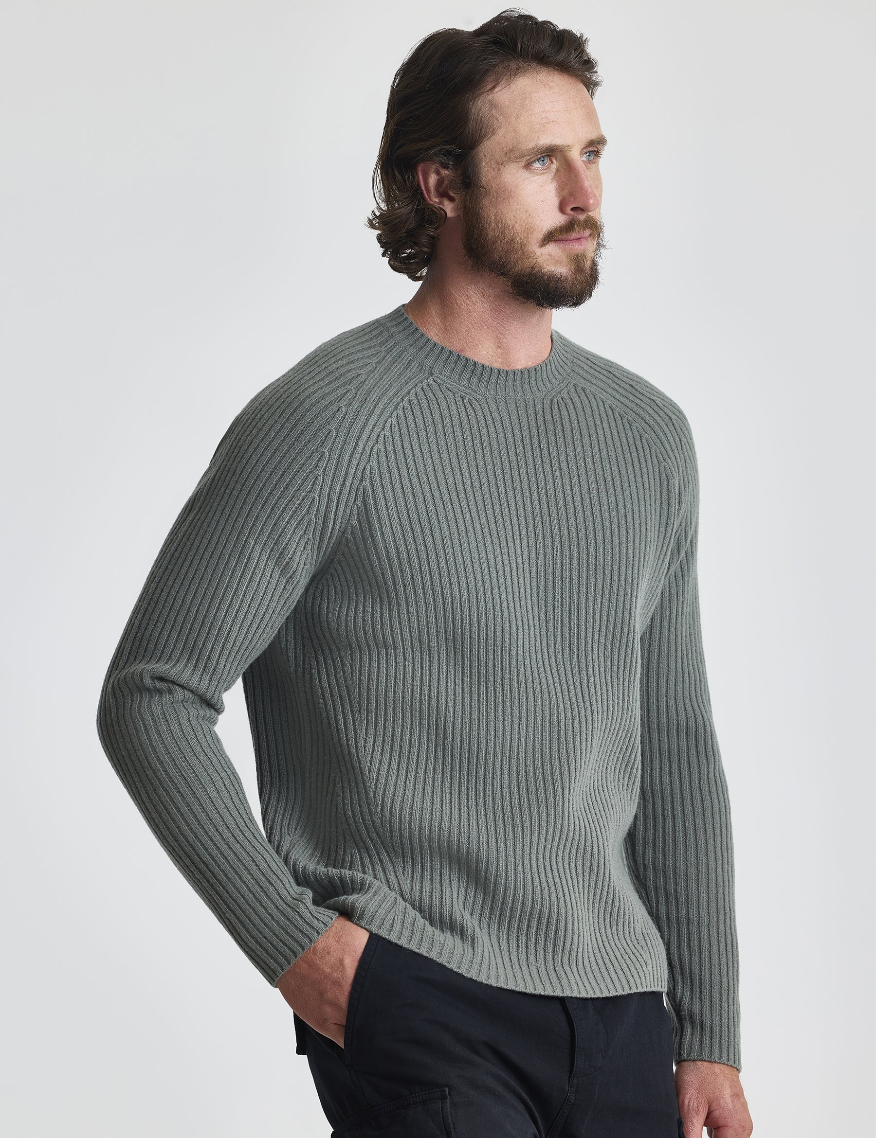 Angled front view of man wearing Lyon Sweater in Gunmetal grey from AETHER Apparel.