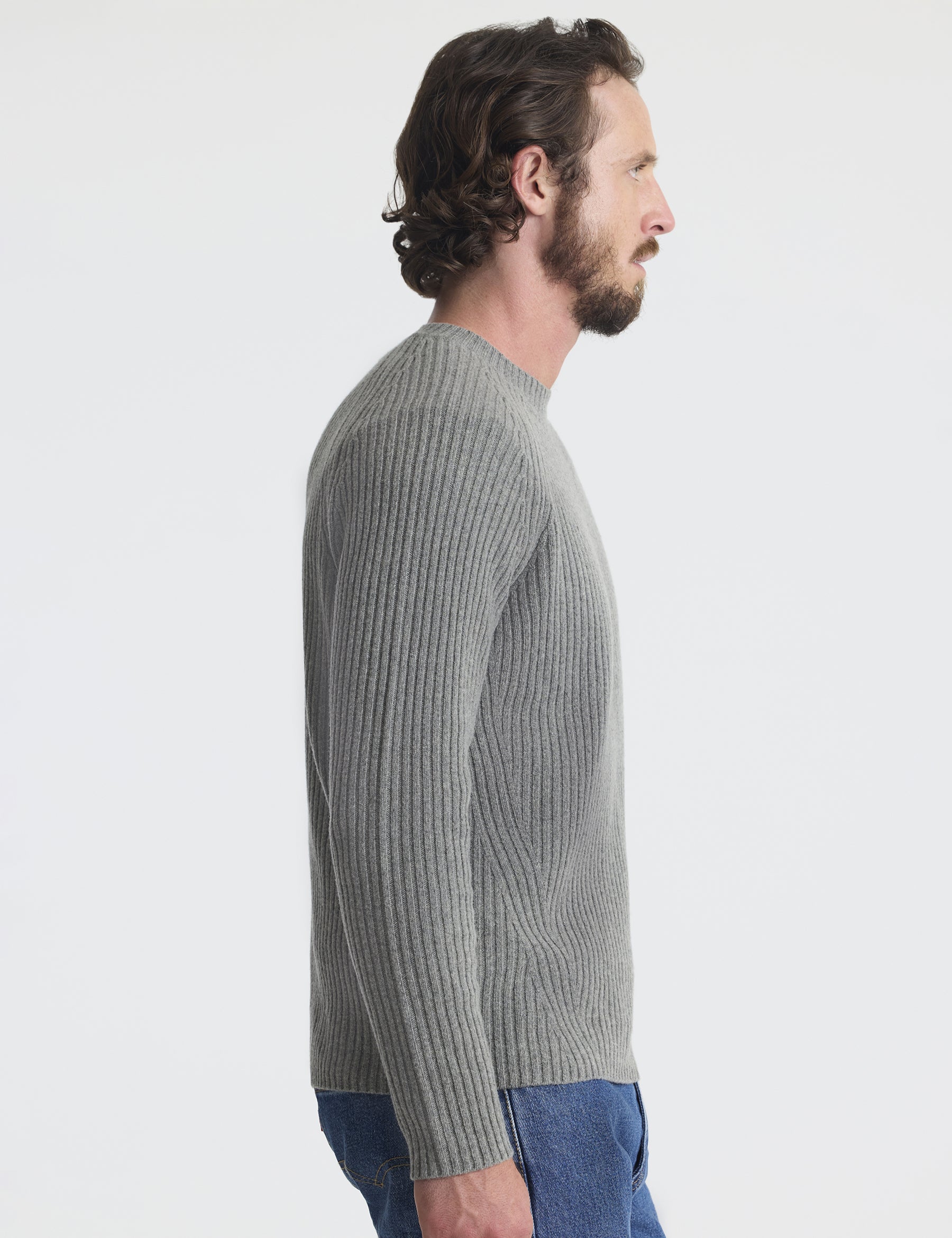 Right profile view of man wearing Lyon Sweater in Heather Grey from AETHER Apparel. 