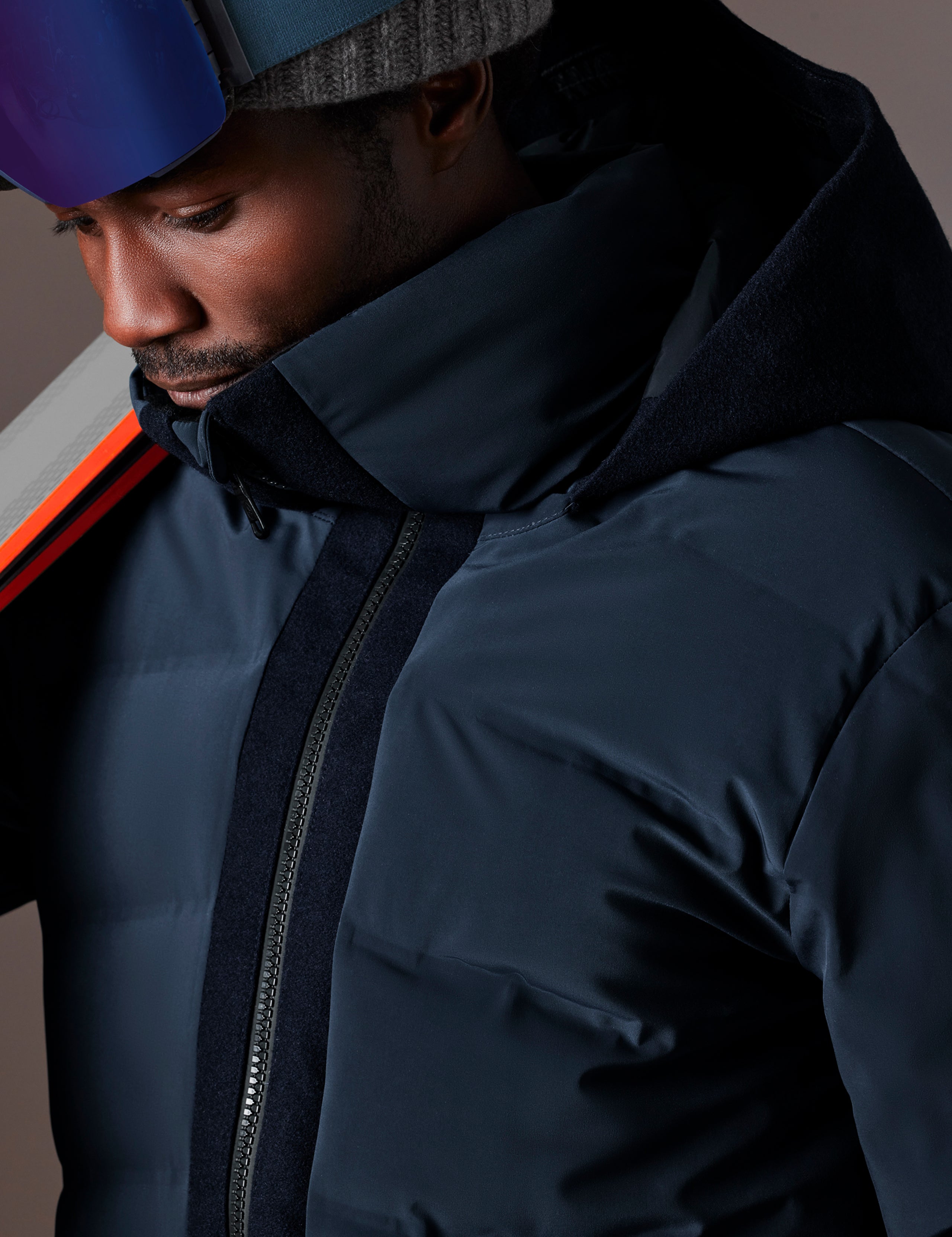 Closeup detailed view of zipper, stitching, and collar on Nordic Jacket in Total Eclipse dark blue from AETHER Apparel.