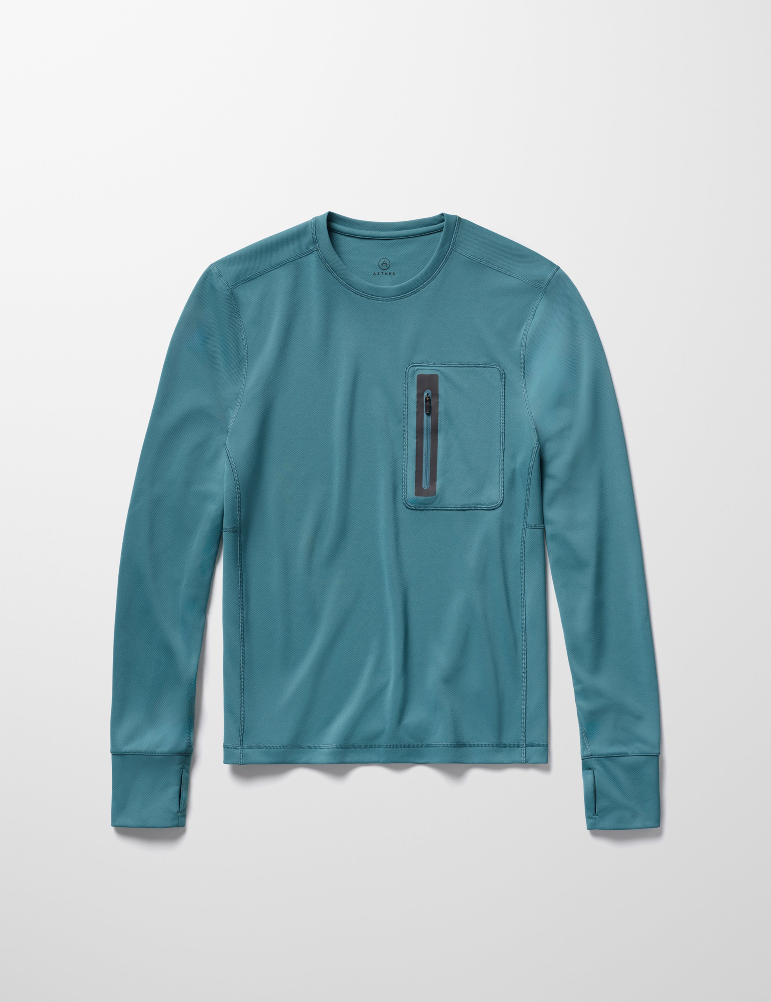 Flay lay image of men’s Pacific Crewneck Sun Shirt in Aqua Blue from AETHER Apparel.