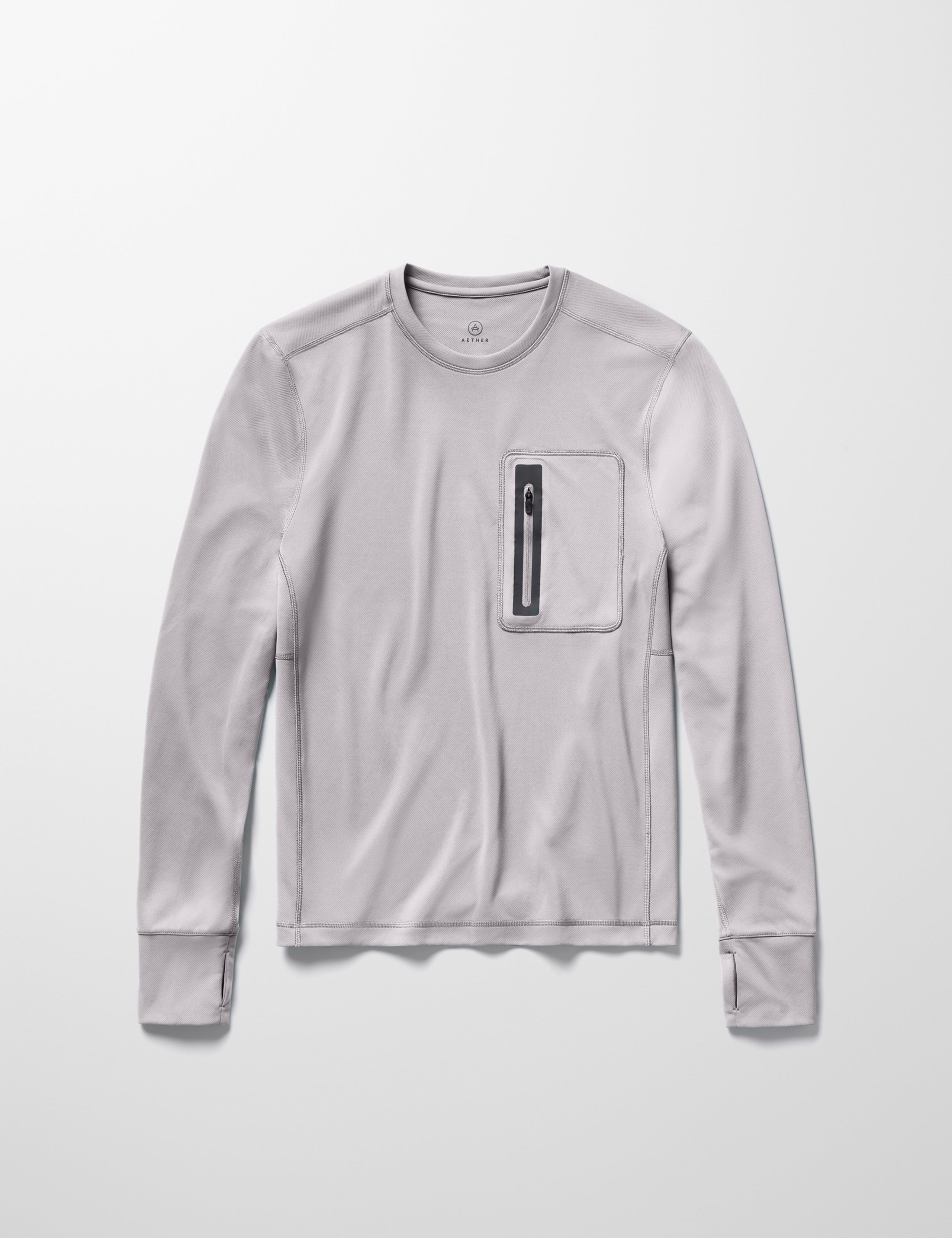 Flay lay image of men’s Pacific Crewneck Sun Shirt in Sky Grey from AETHER Apparel.
