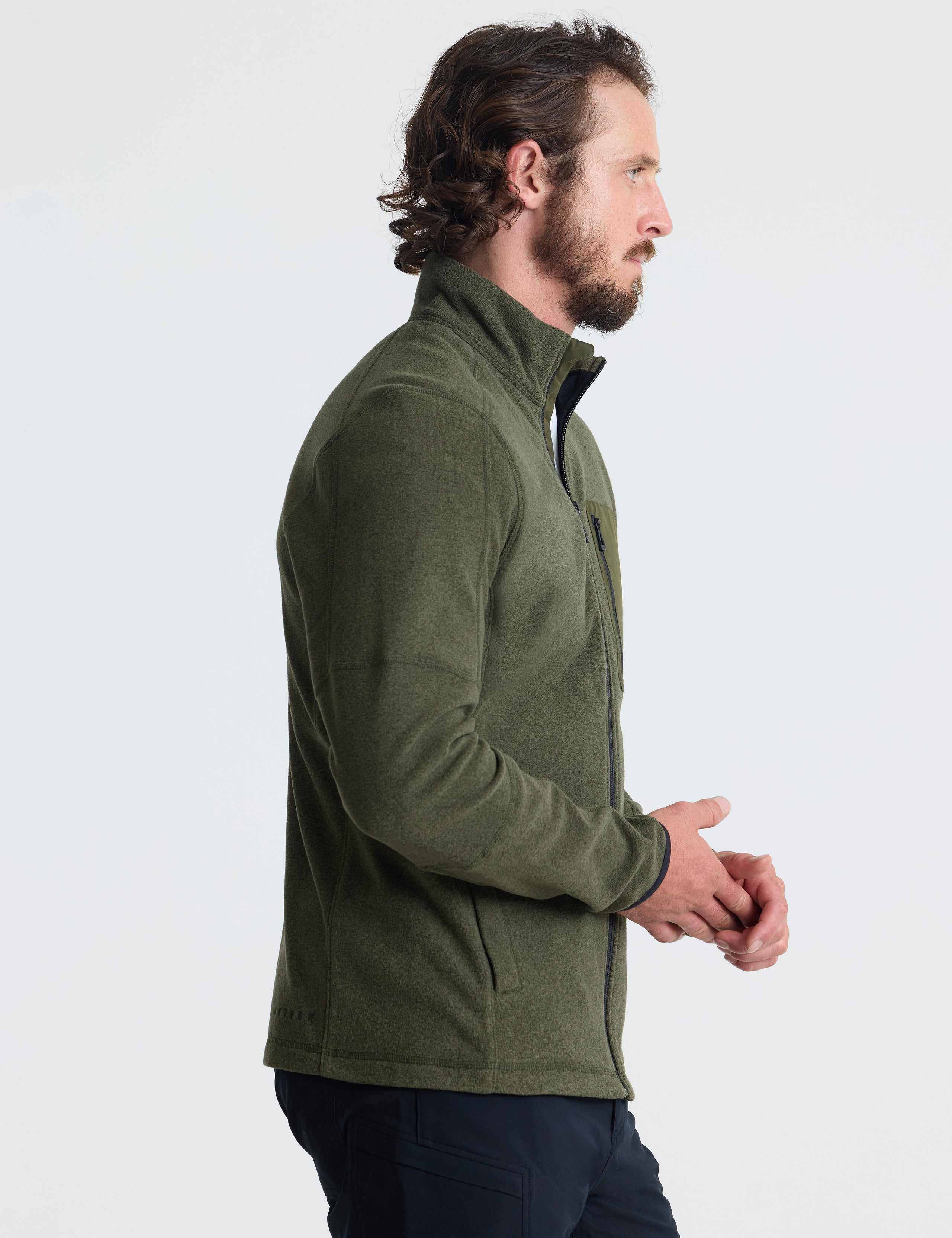 Right profile view of man wearing Sutherlin Full-Zip in Forest Green from AETHER Apparel.