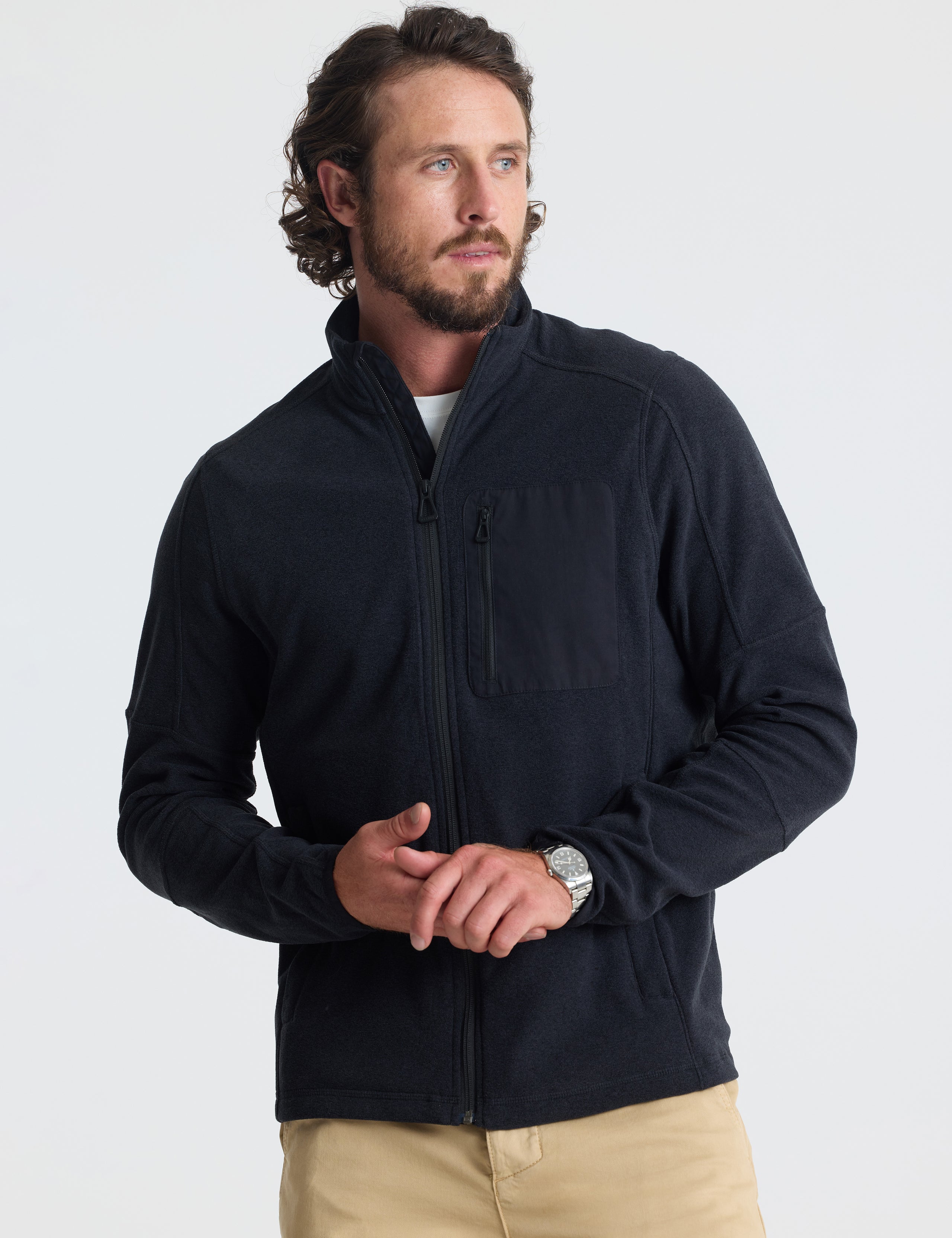 Front view of man wearing Sutherlin Full-Zip in Onyx Black from AETHER Apparel.