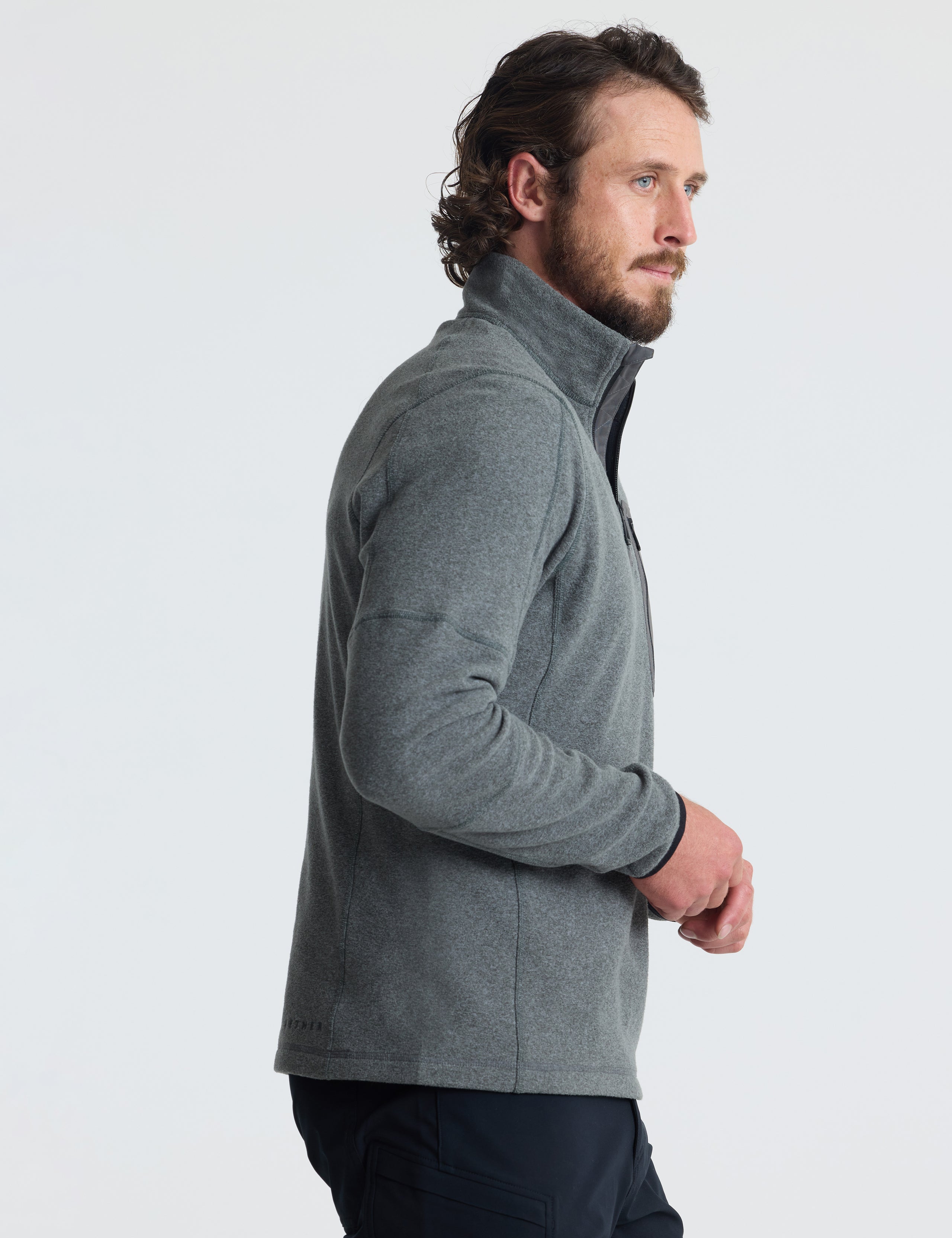 Right profile view of man wearing Sutherlin Half-Zip in Charcoal Heather from AETHER Apparel.