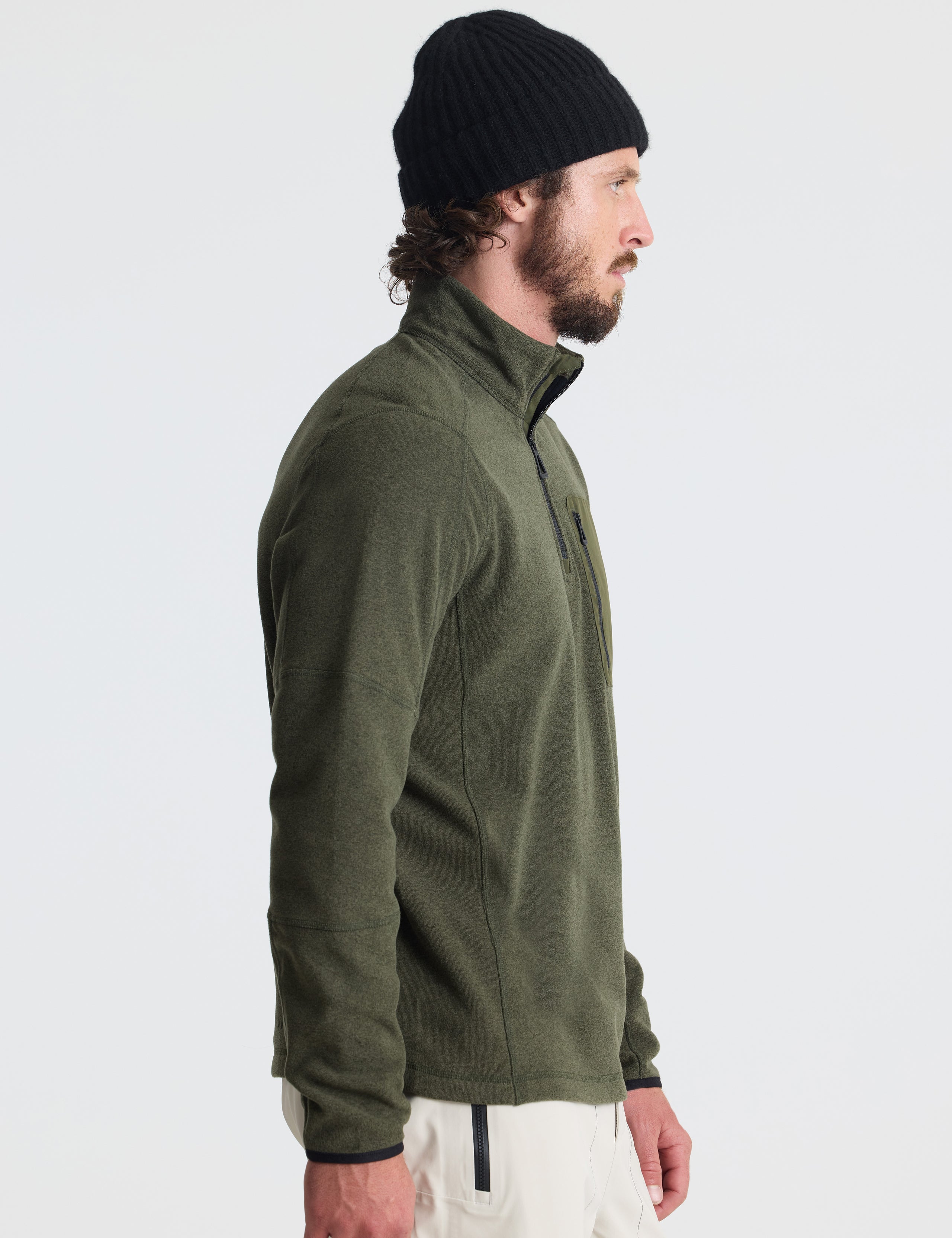 Right profile of man wearing Sutherlin Half-Zip in Forest Green from AETHER Apparel.