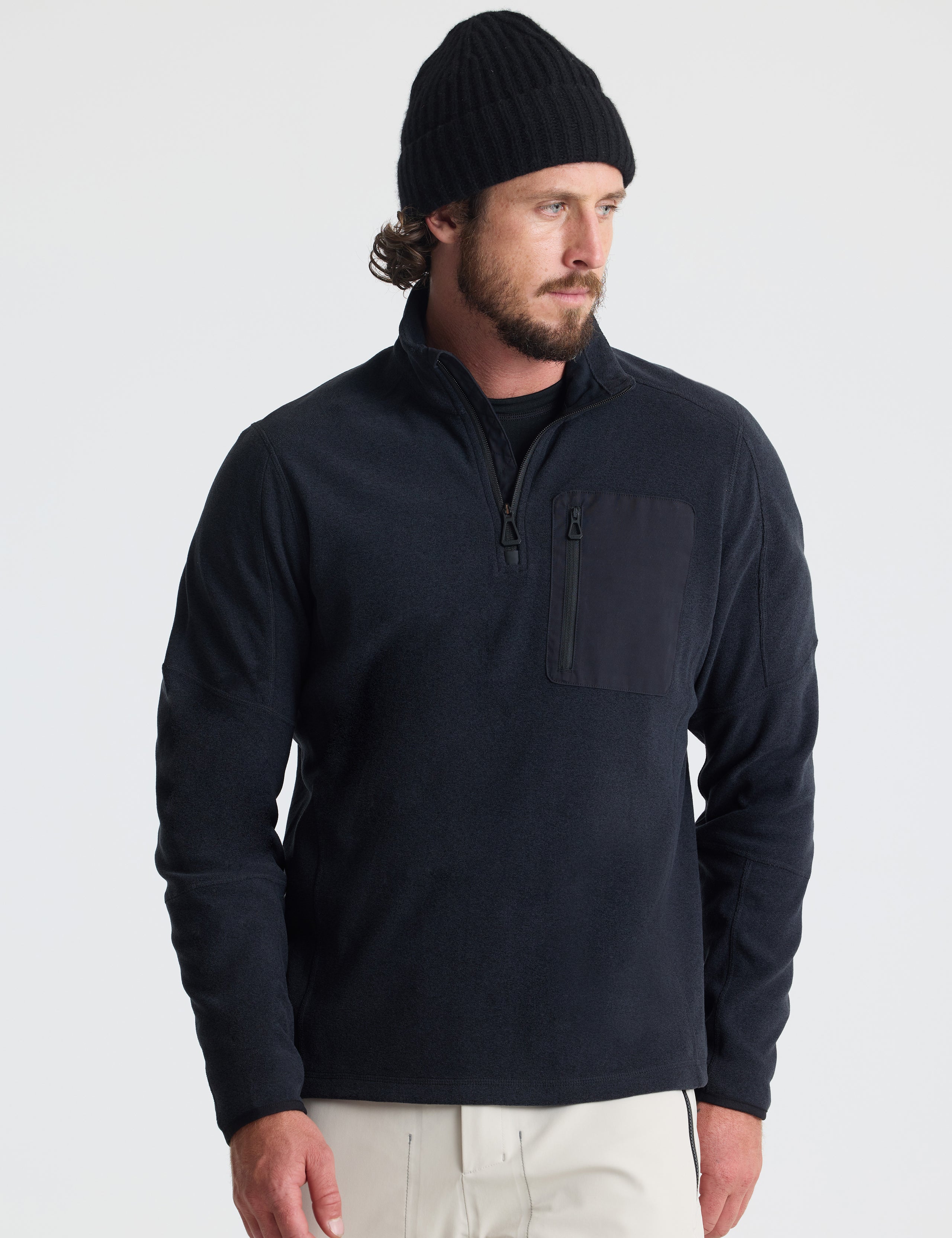 Front view of man wearing Sutherlin Half-Zip in Onyx Black from AETHER Apparel.
