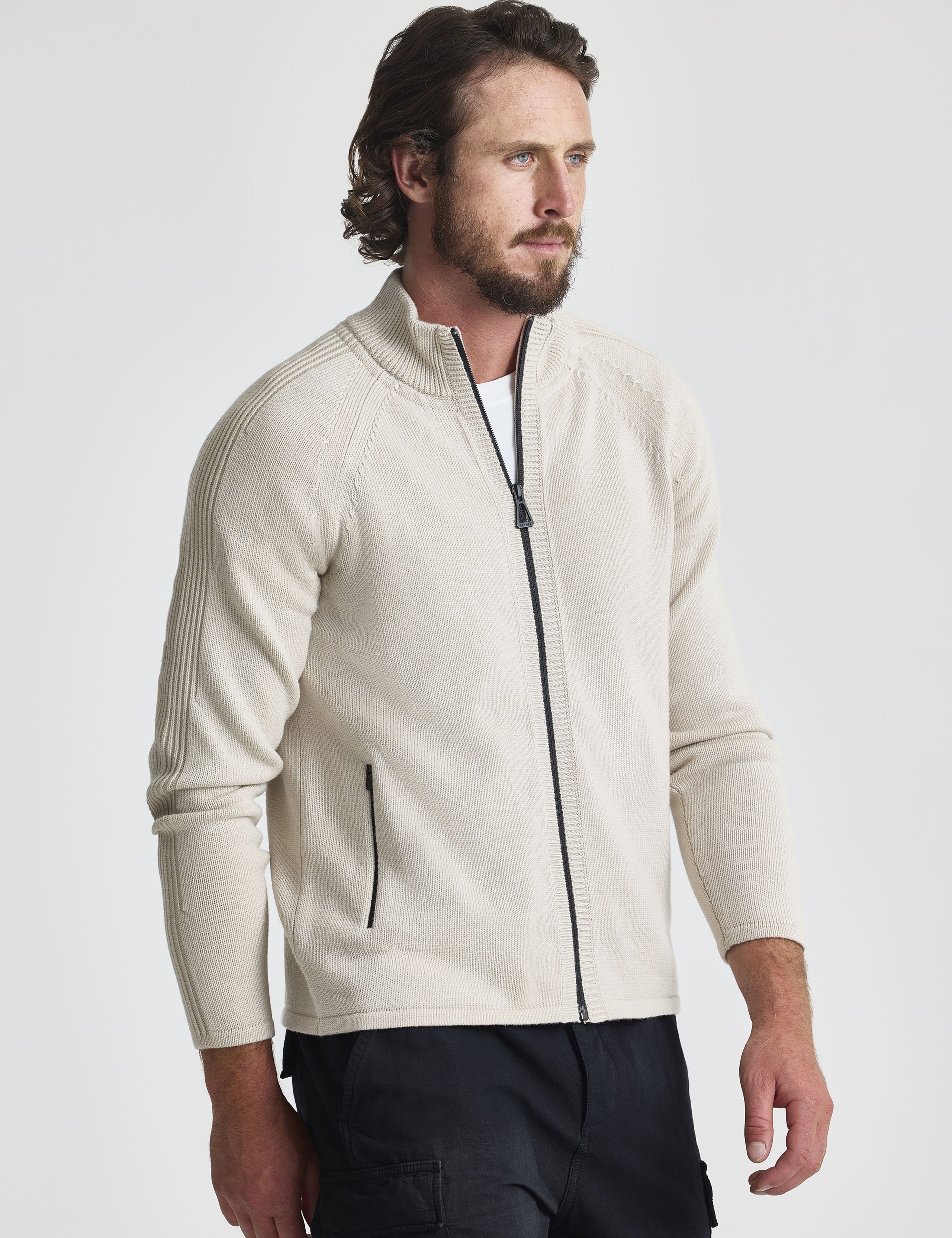 Front view of man wearing Riley Full-Zip Sweater in Bone white from AETHER Apparel.