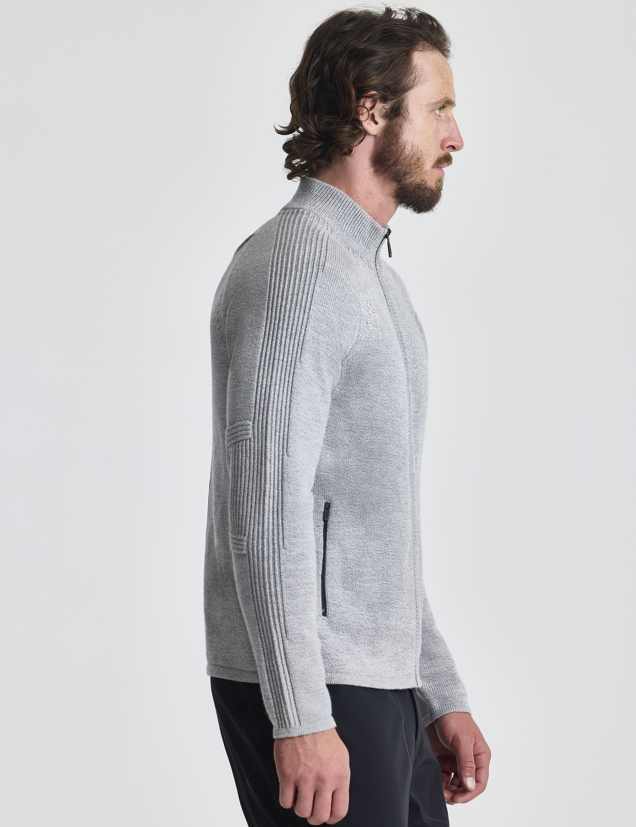 Right profile view of man wearing Riley Full-Zip Sweater in Light Heather Grey from AETHER Apparel.