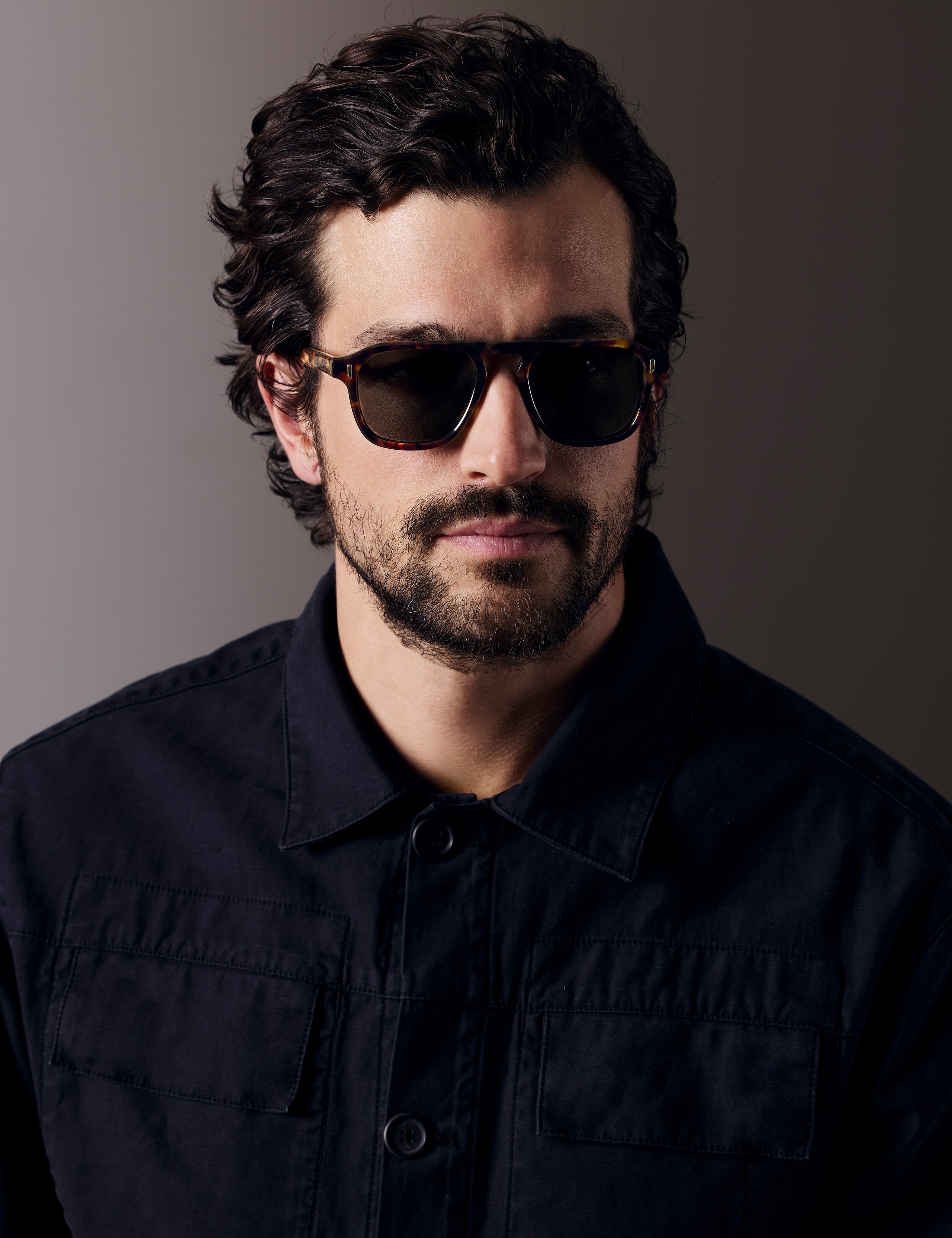 Front right 3/4 view of man wearing Sequoia Sunglass in Tortoise with Deep G15 Lens from AETHER Apparel.