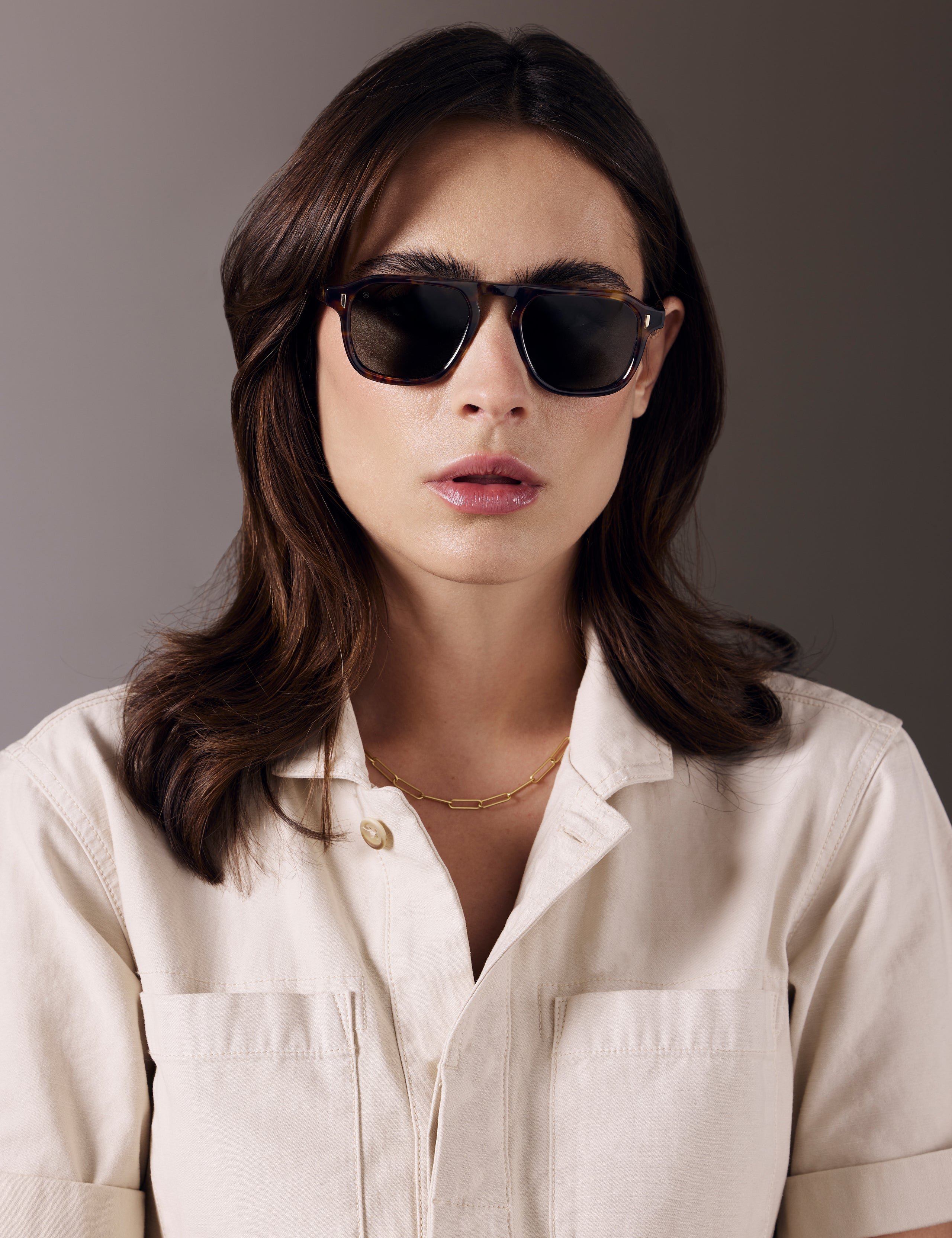 Front view of woman wearing Sequoia Sunglass in Tortoise with Deep G15 Lens from AETHER Apparel.